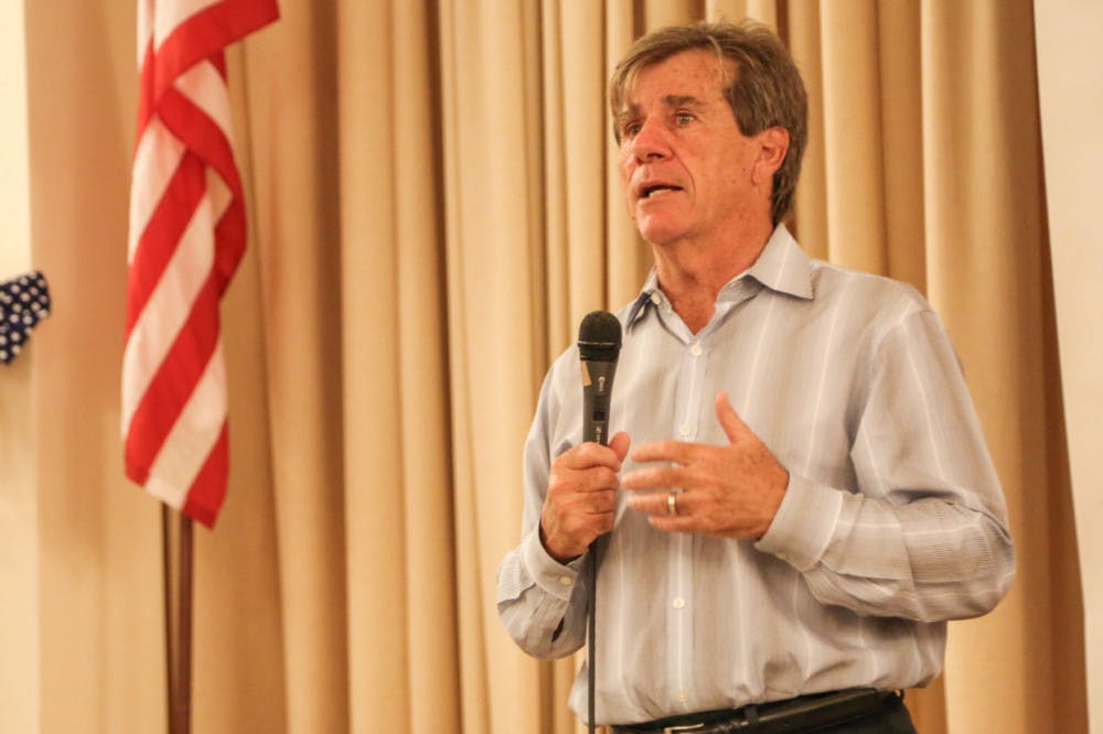 Rod Smith, who lost the race for Florida State Senate, address a crowd at a watch party at the Gainesville Woman's Club on Tuesday night. "It is always worth the fight," he specifically told the younger people in the crowd.