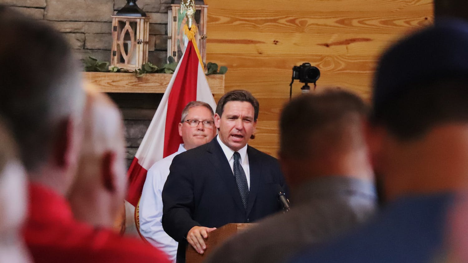 Gov. Ron DeSantis speaks to a crowd of over 200 involved in a lawsuit filed against the City of Gainesville for mandating vaccines for city employees at Clark Plantation Wedding Venue in Newberry, Florida, on Monday, Sept. 13, 2021. 