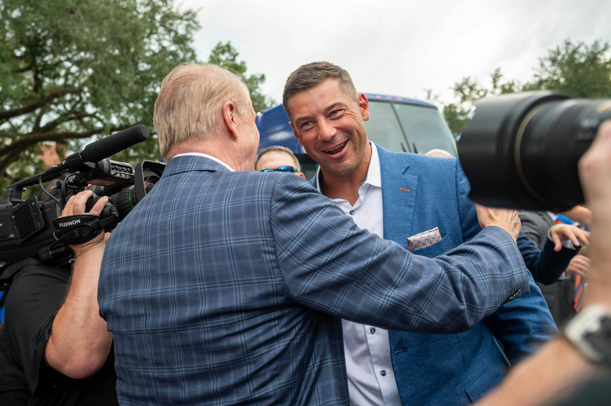 Florida head coach Jon Sumrall hugs UF President Dr. Stuart Bell before an NCAA college football game against FAU, Saturday, Sept. 5, 2026, in Gainesville, Fla.