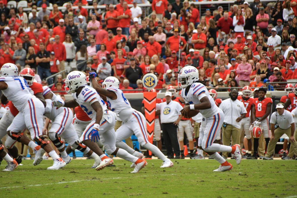 Freshman quarterback Emory Jones (5) got meaningful playing time against Georgia on Saturday. He carried the ball four times for 12 yards and threw a deep pass that drew a pass-interference call. 