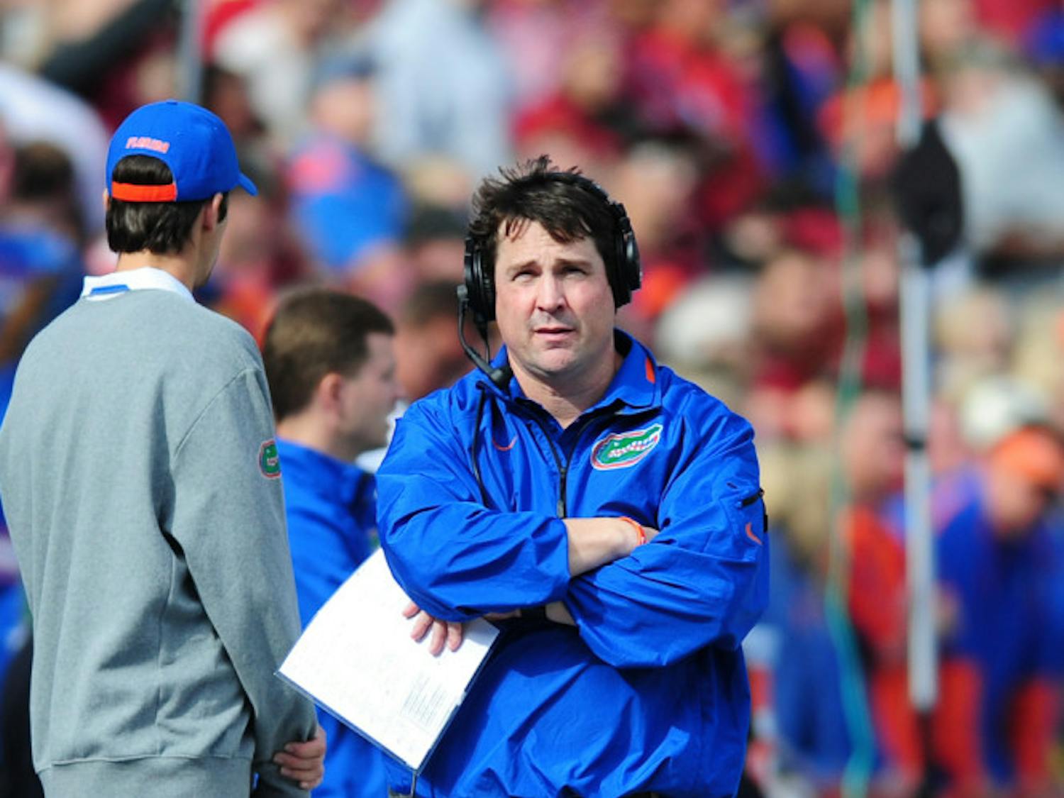 UF coach Will Muschamp watches on during Florida's 37-7 loss to No. 2 FSU on Saturday at Ben Hill Griffin Stadium. The Gators earned commitments from two 2014 four-star recruits on Thursday.