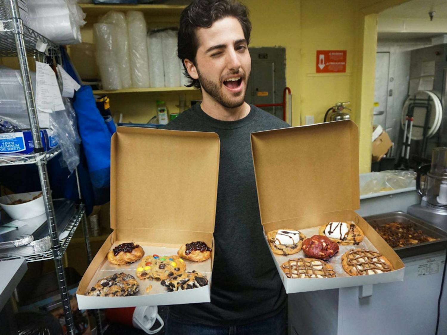 Daniel Leal, a 22-year-old UF sustainability studies senior and founder of cookie-delivery company Cookiegazm, poses with a batch of his cookies in October 2016. The late-night cookie delivery business announced it was closing on Facebook. 