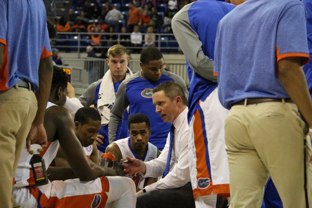 <p>UF coach Mike White talks to his players during a timeout during Florida’s 95-63 win against Auburn on Jan. 23, 2016, in the O’Connell Center.</p>