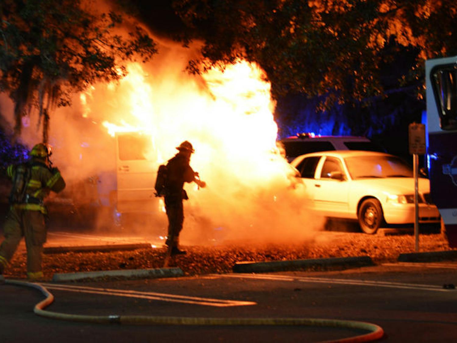 A UF utility van is engulfed in flames around 10 p.m. Friday on the UPD parking lot. Gainesville Fire Rescue rushed to the scene and extinguished the blaze in minutes.