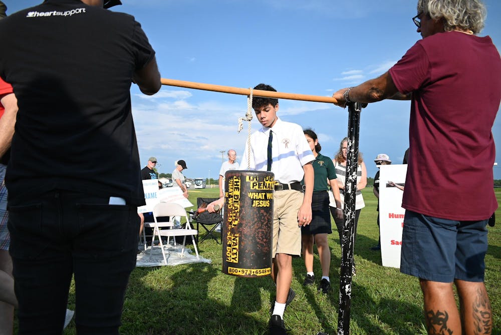 <p>Students from Lourdes Academy bang a hammer on a metal cylinder in solidary with convicted felon Curtis Windom. Curtis Windom was executed at Florida State Prison on Thursday, Aug. 28th, 2025.</p>