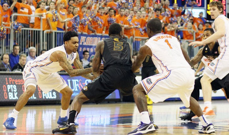 Guards Mike Rosario (left) and Kenny Boynton (1) force a turnover from Missouri’s Keion Bell (5) during Florida’s 83-52 win on Jan. 19 in the O’Connell Center. Florida is averaging 8.8 steals per game in conference play.