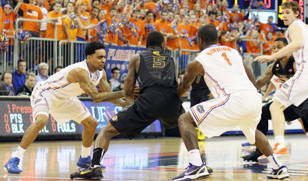 <p>Guards Mike Rosario (left) and Kenny Boynton (1) force a turnover from Missouri’s Keion Bell (5) during Florida’s 83-52 win on Jan. 19 in the O’Connell Center. Florida is averaging 8.8 steals per game in conference play.</p>