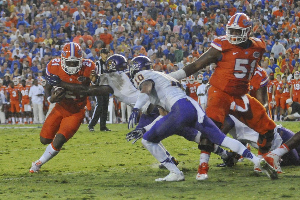 <p dir="ltr" align="justify">UF running back Kelvin Taylor carries the ball during Florida's 31-24 win against East Carolina on Sept. 12, 2015, at Ben Hill Griffin Stadium.</p>