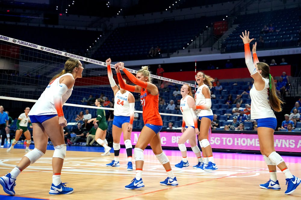 The Gators volleyball team celebrates during the third set in their 3-2 victory against the Sacramento State Hornets Thursday, Sept. 7, 2023.