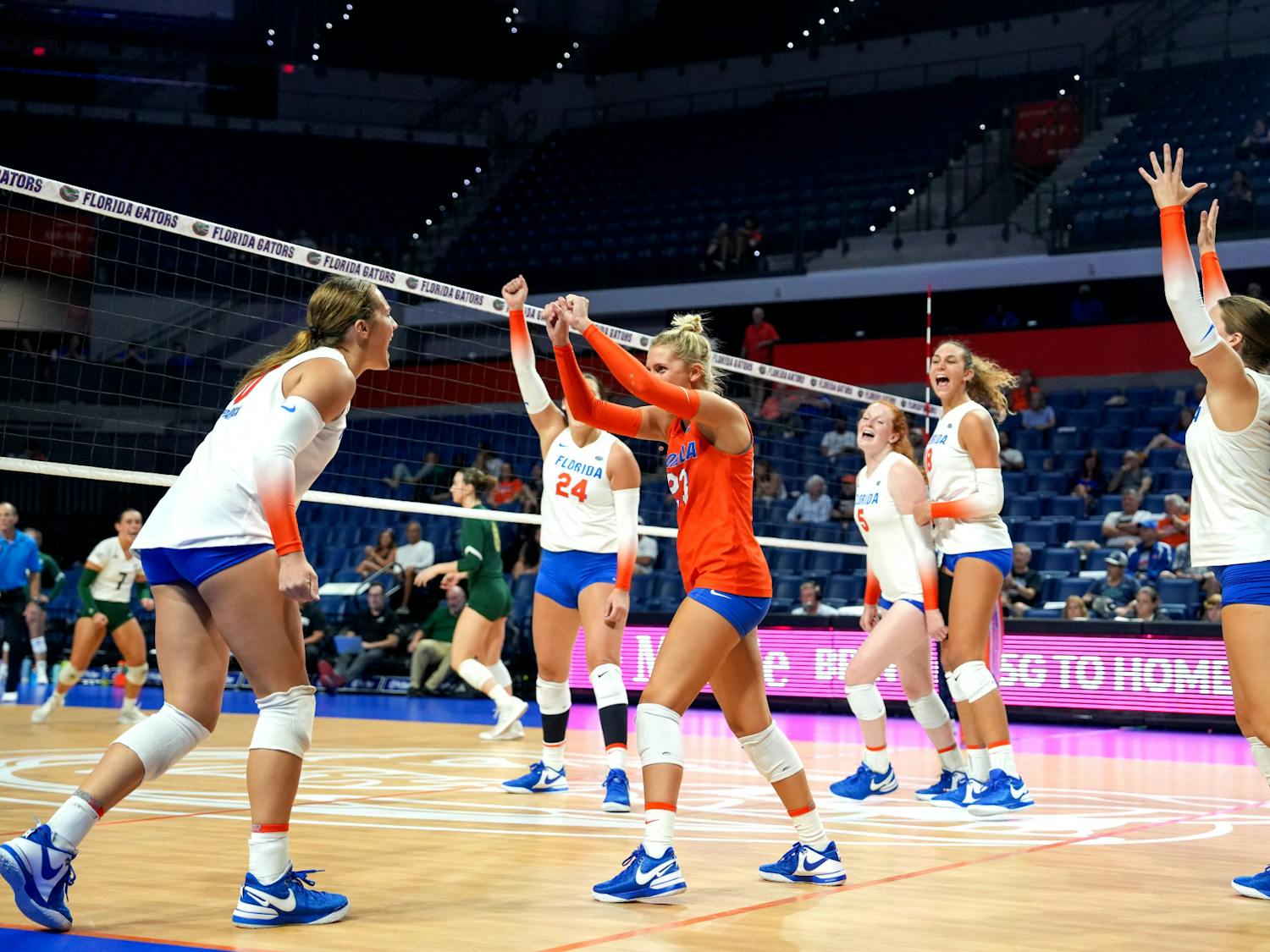 The Gators volleyball team celebrates during the third set in their 3-2 victory against the Sacramento State Hornets Thursday, Sept. 7, 2023.