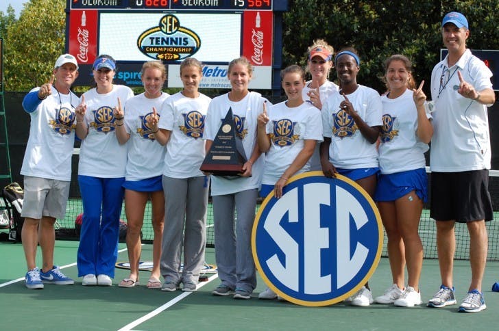 Florida’s women’s tennis team poses for a photo after winning its third straight Southeastern Conference Championship on Sunday by beating Georgia 4-1 in Oxford, Miss.