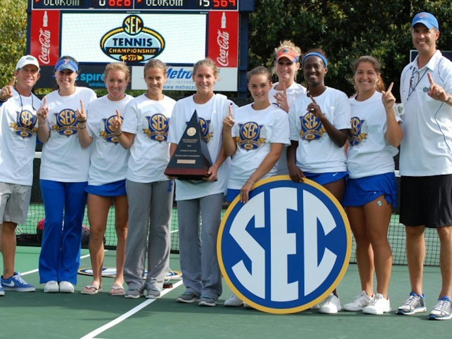 Florida’s women’s tennis team poses for a photo after winning its third straight Southeastern Conference Championship on Sunday by beating Georgia 4-1 in Oxford, Miss.