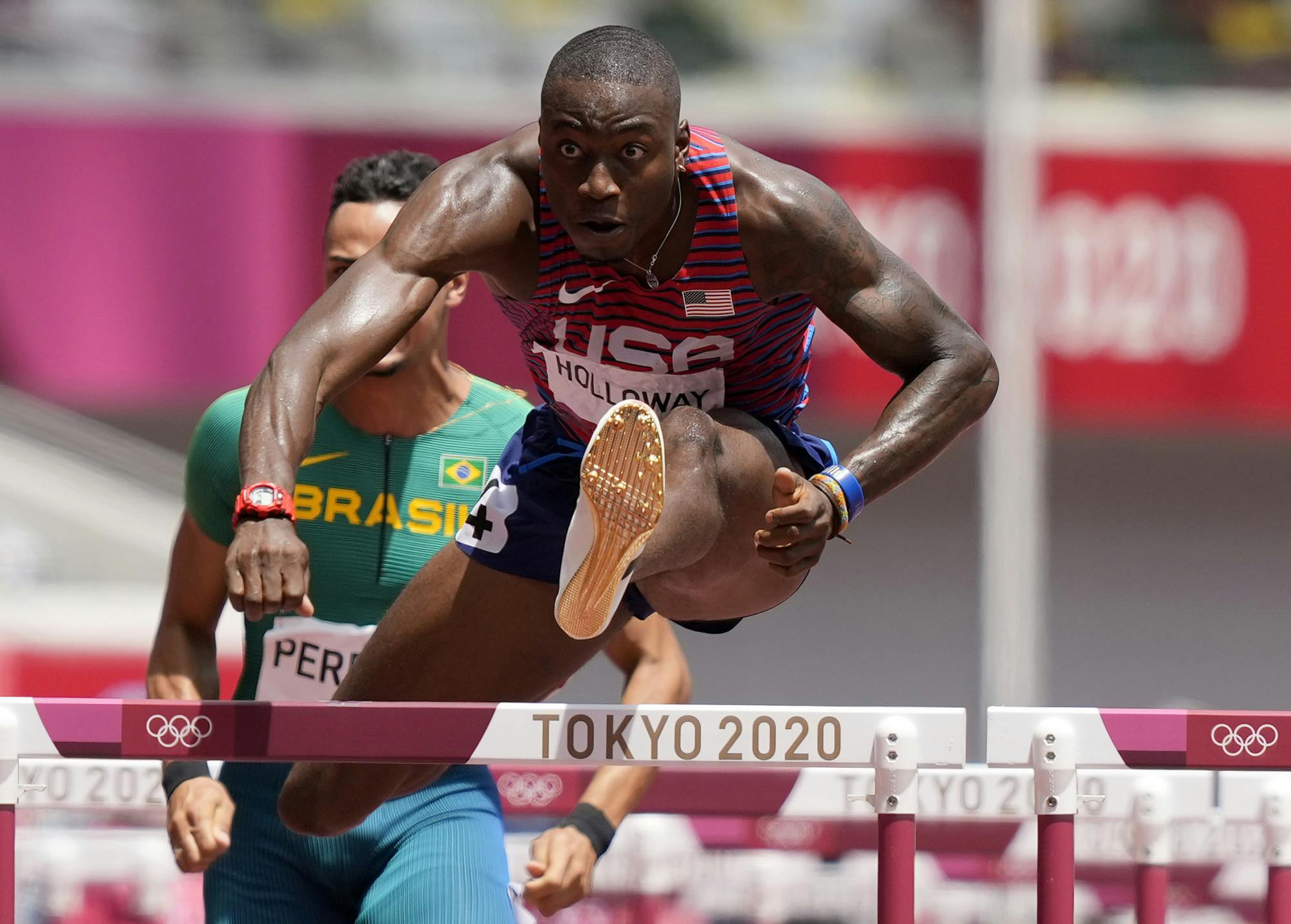 Grant Holloway, of United States competes in a men's 110-meter hurdles semifinal at the 2020 Summer Olympics, Wednesday, Aug. 4, 2021, in Tokyo, Japan. (AP Photo/Martin Meissner)