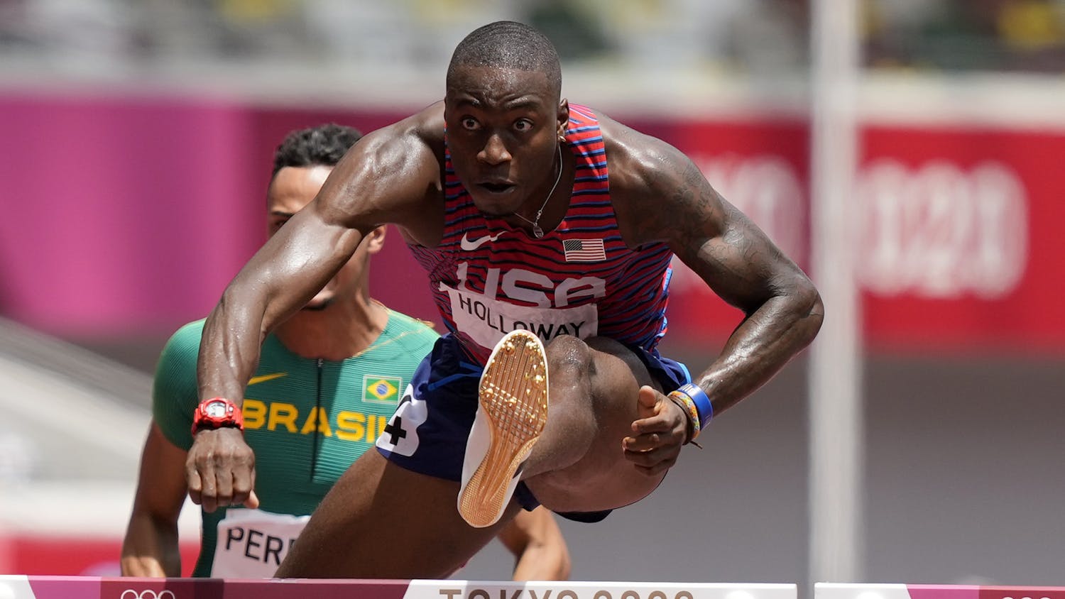 Grant Holloway, of United States competes in a men's 110-meter hurdles semifinal at the 2020 Summer Olympics, Wednesday, Aug. 4, 2021, in Tokyo, Japan. (AP Photo/Martin Meissner)