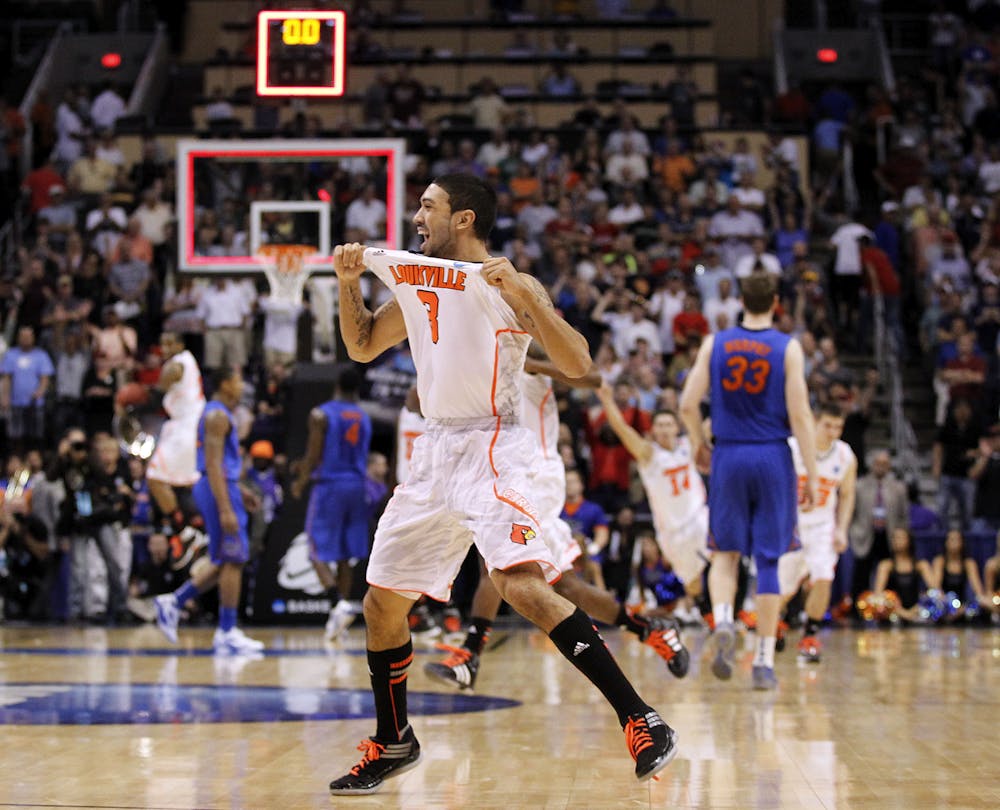 <p>Louisville's Peyton Siva (3) celebrates his team's 72-68 win over Florida in an NCAA tournament West Regional final college basketball game, Saturday, March 24, 2012, in Phoenix. (AP Photo/Chris Carlson)</p>