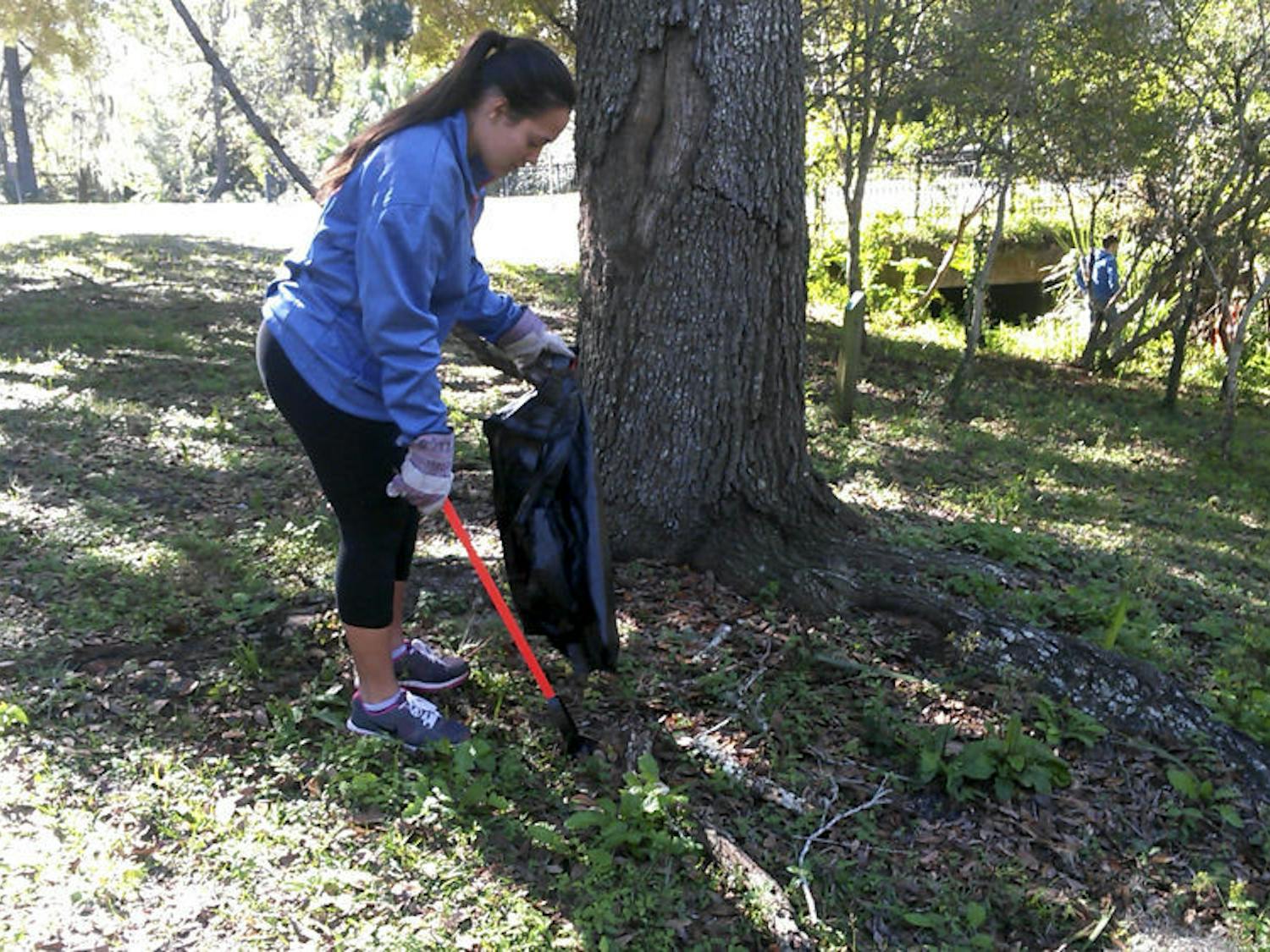 Lisette Pellot, an 18-year-old UF political science freshman is one of the site leaders for Keeping Alachua County Beautiful. “It's important for UF to celebrate this and show that we are all whole," Pellot said.
