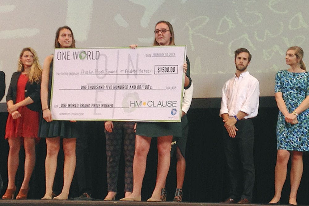 Audrey Batzer, left, and Avalon Hoek Spaans, both 20-year-old UF environmental science students, receive a $1,500 prize for having the most innovative idea at UF’s One World conference, during which six student teams present their ideas to make the world sustainable. Batzer and Hoek Spaan’s company, called “Ferns for Feed,” would promote the growth of the azolla fern, which would be used for fertilizer, feed and to combat global warming.