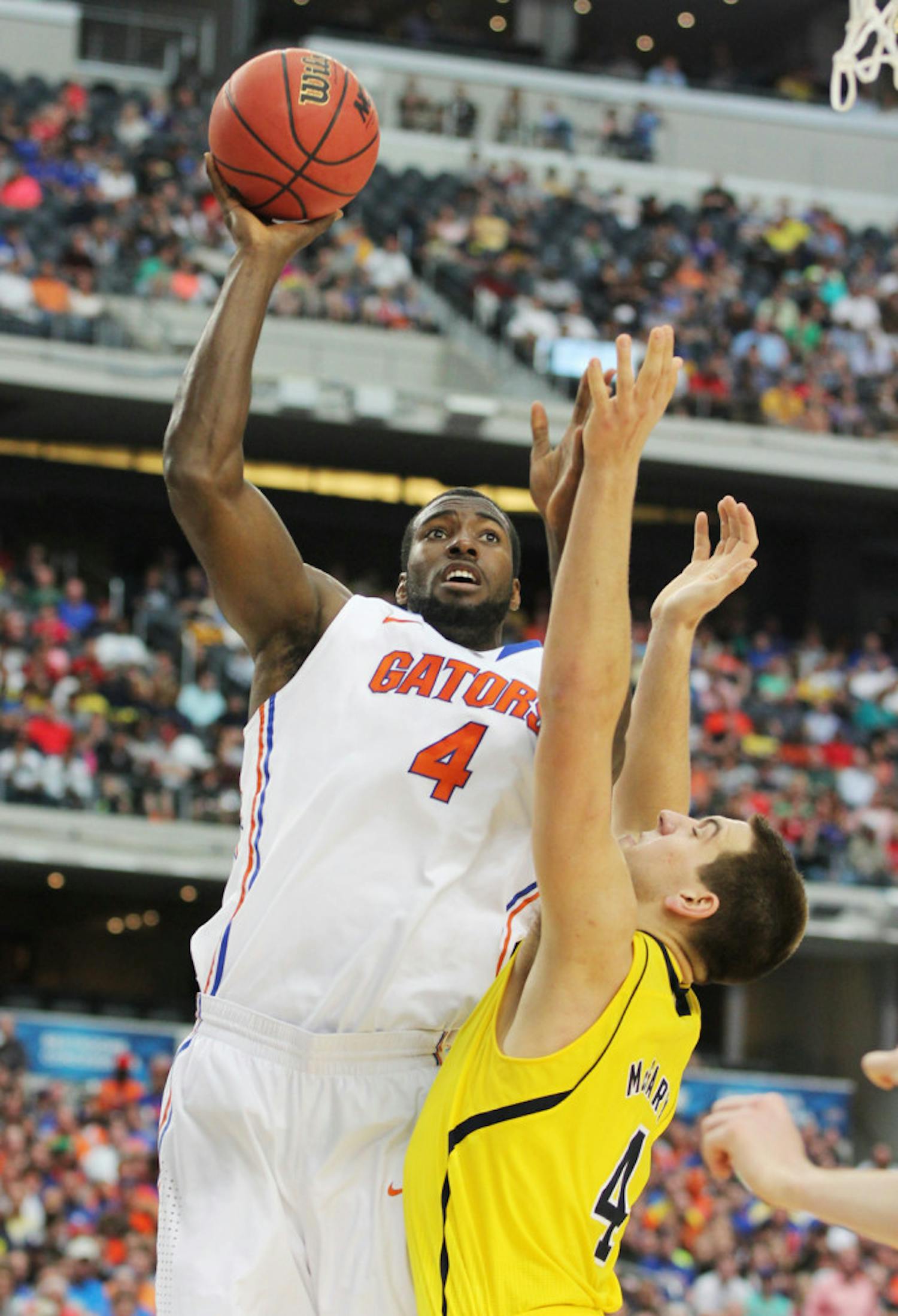 Center Patric Young attempts a shot during Florida’s 79-59 Elite Eight loss to Michigan on March 31 in Arlington, Texas.