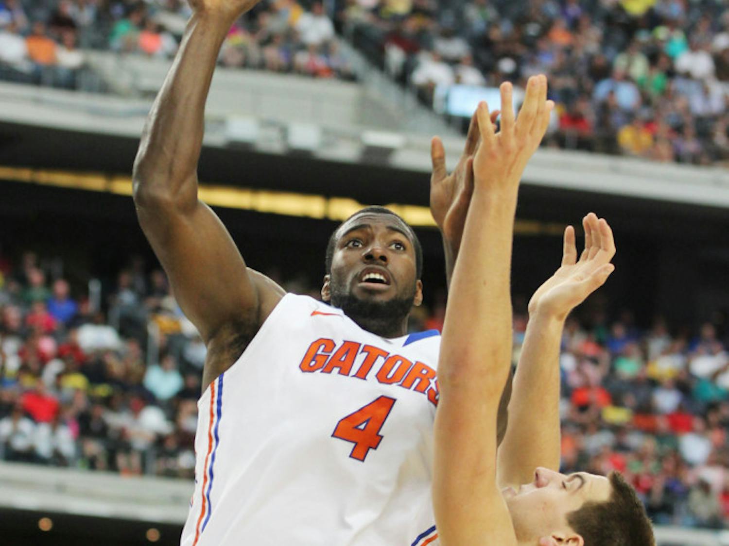 Center Patric Young attempts a shot during Florida’s 79-59 Elite Eight loss to Michigan on March 31 in Arlington, Texas.