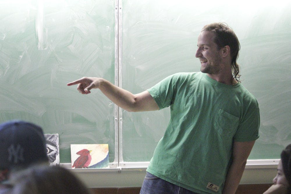 Jordan Shepherd, a 23-year-old sushi roller and former president of NORML Gators, jumps in to freestyle rap during the club’s meeting on cannabis and creativity Sept. 22, 2015. “Sober is hard, guys,” he said, laughing, after his performance.