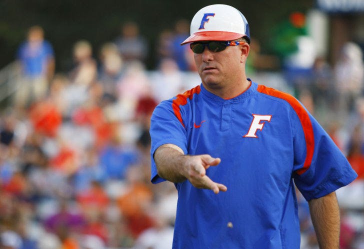 Coach Tim Walton signals to a base runner during Florida’s 3-1 victory against Auburn on April 14, 2012 at Katie Seashole Pressly Stadium. Walton has started freshman Taylor Schwarz at first base in every Southeastern Conference game.
