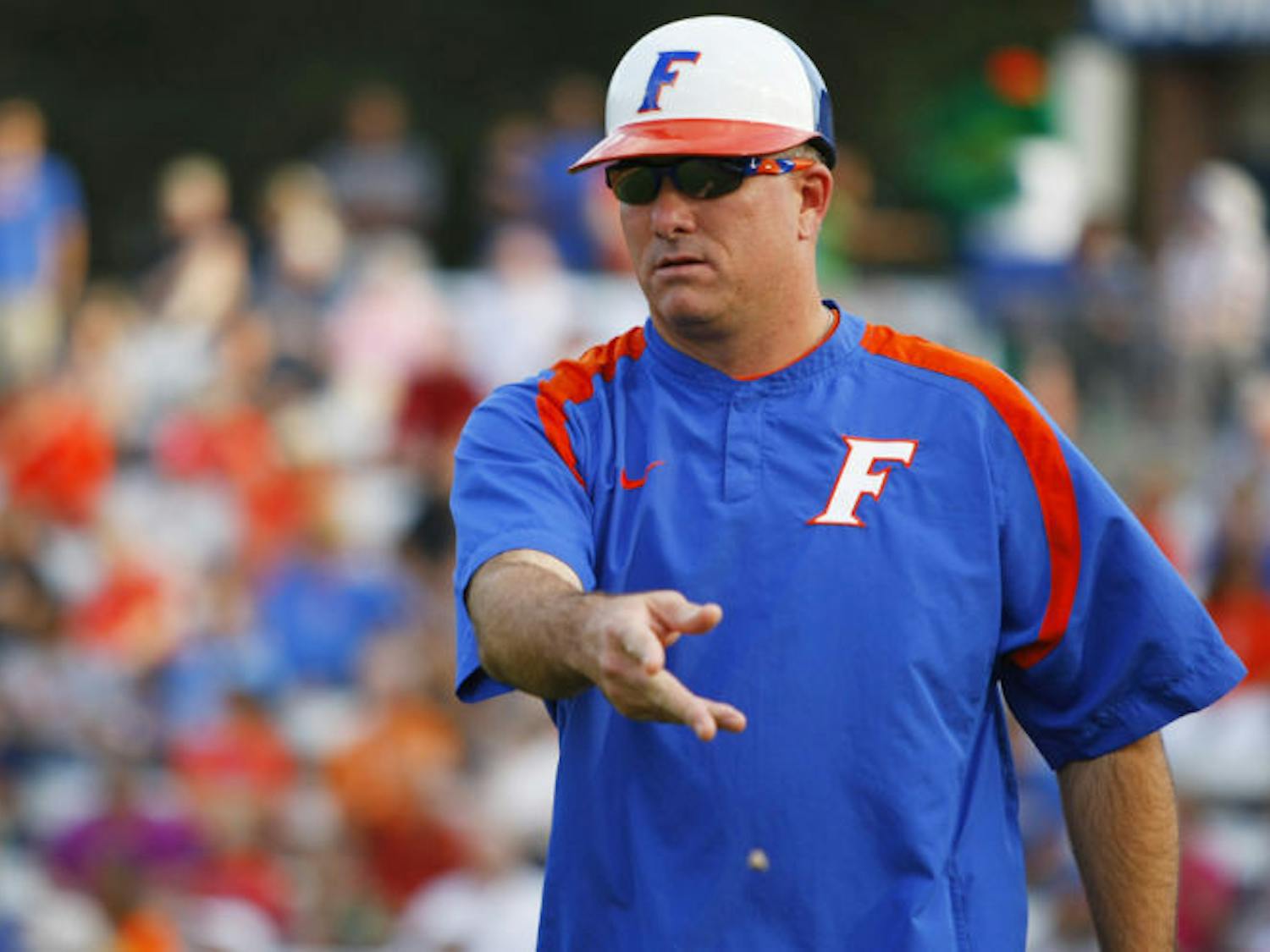 Coach Tim Walton signals to a base runner during Florida’s 3-1 victory against Auburn on April 14, 2012 at Katie Seashole Pressly Stadium. Walton has started freshman Taylor Schwarz at first base in every Southeastern Conference game.
