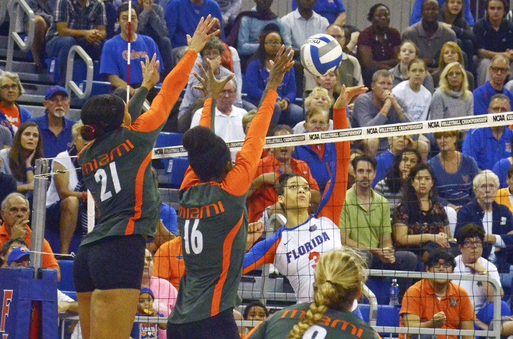 Right-side hitter Alex Holston swings for a kill during Florida's 3-1 win against Miami in the second round of the NCAA Tournament on Dec. 6 in the O'Connell Center.