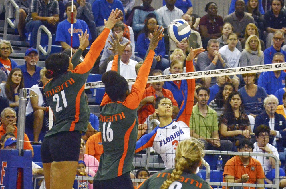 <p>Right-side hitter Alex Holston swings for a kill during Florida's 3-1 win against Miami in the second round of the NCAA Tournament on Dec. 6 in the O'Connell Center.</p>