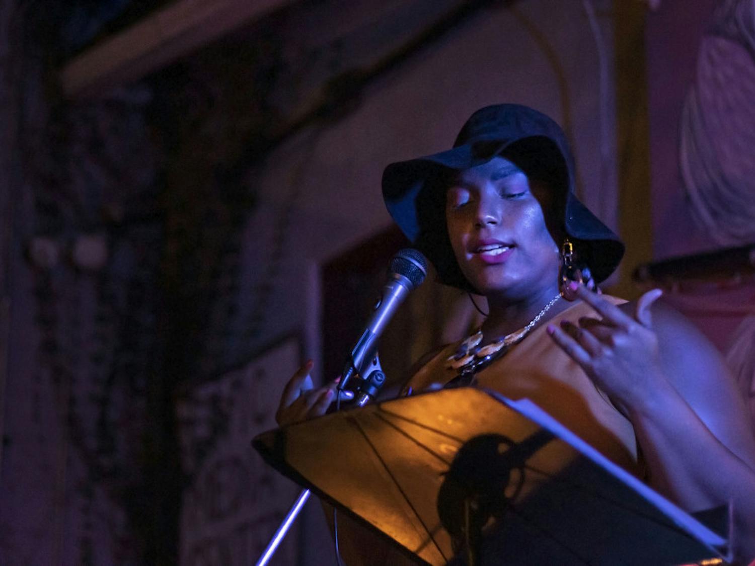 Kayla Rodney performs at the open mic night Sept. 24 at the Civic Media Center. Rodney was the featured artist for the night, which had a theme of Afrofuturism, a genre of media that blends black culture with science fiction and technology.