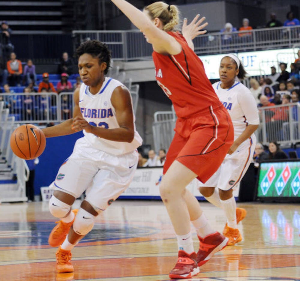 <p>Kayla Lewis drives toward the net during Florida’s win against Georgia on Jan. 19 in the O’Connell Center.</p>