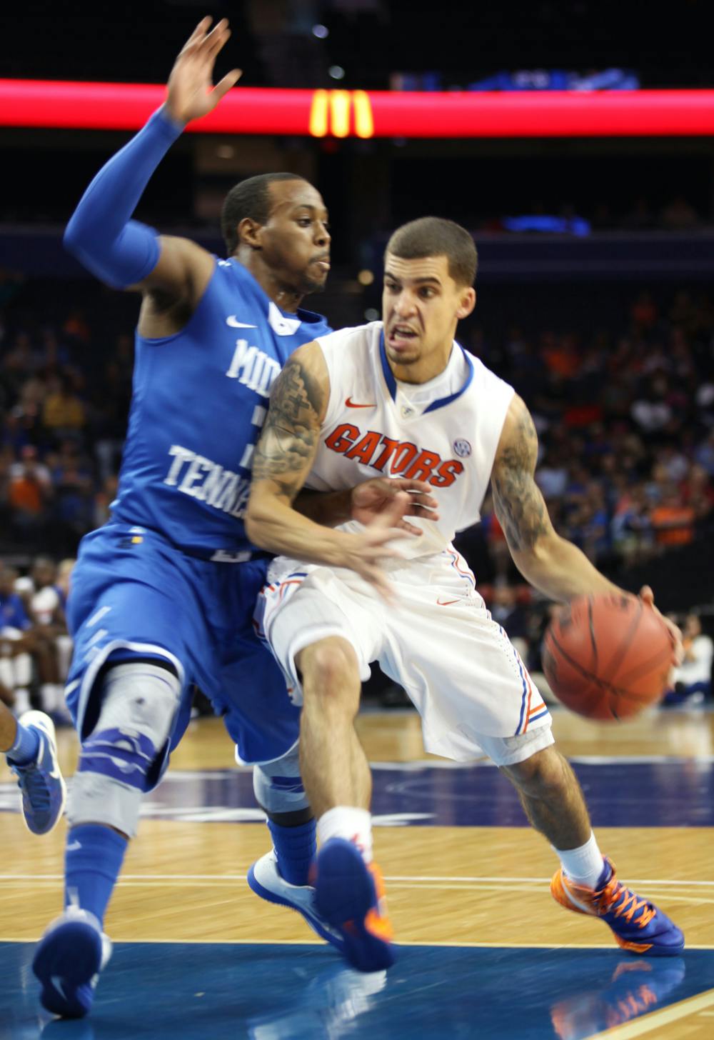 Guard Scottie Wilbekin (5) drives against Middle Tennessee in UF’s 66-45 win on Nov. 18 in Tampa.  
