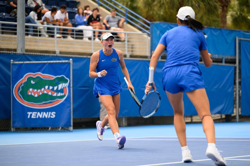 Florida tennis player Nikola Daubnerova celebrates a point with her doubles partner Xinyi Nong during an NCAA tennis match against Oklahoma, Saturday, Feb. 28, 2026, in Gainesville, Fla.