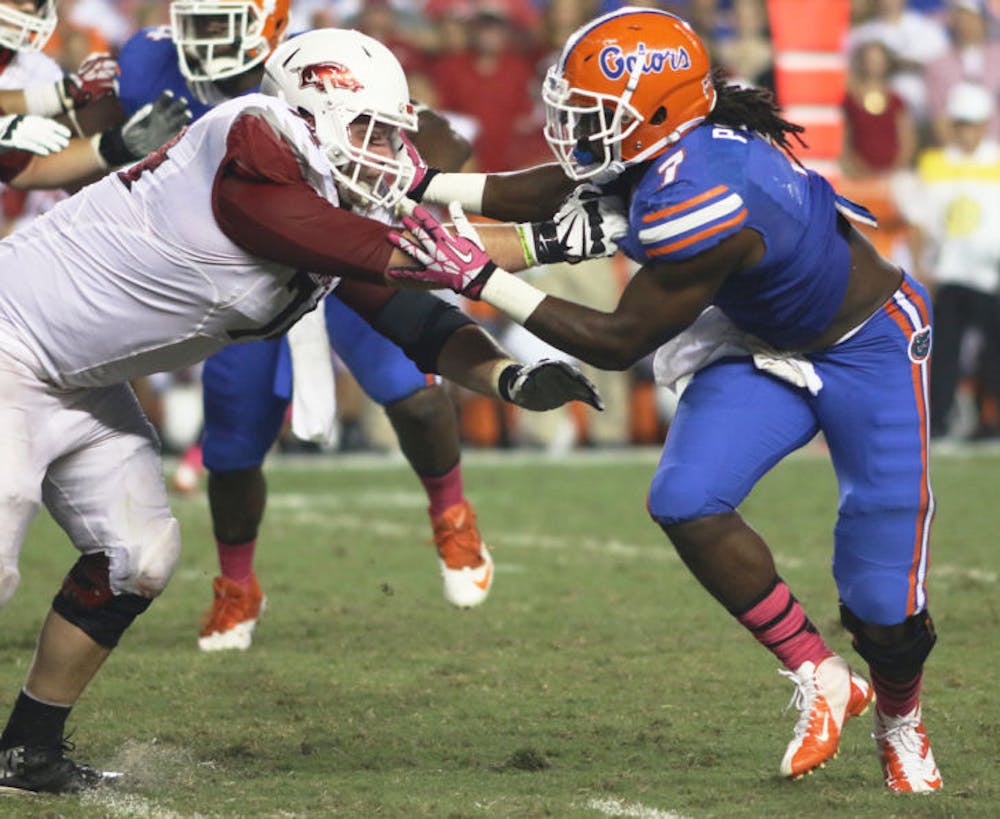 <p>Ronald Powell attempts to shed a block during Florida’s 30-10 victory against Arkansas on Oct. 5 in Ben Hill Griffin Stadium. Powell will play LSU on Saturday for the first time since the Gators lost to the Tigers 41-11 in Tiger Stadium during the 2011 season.</p>