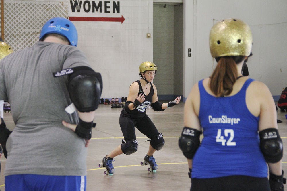 Christina Cates, head captain of The Gainesville Roller Rebels, teaches attendees about falling in roller derby at the team’s recruitment boot camp Sept. 13, 2015, at the Alachua County Fairgrounds. The Roller Rebels held the event to recruit new skaters, non-skater officials and referees to build the league in Gainesville.