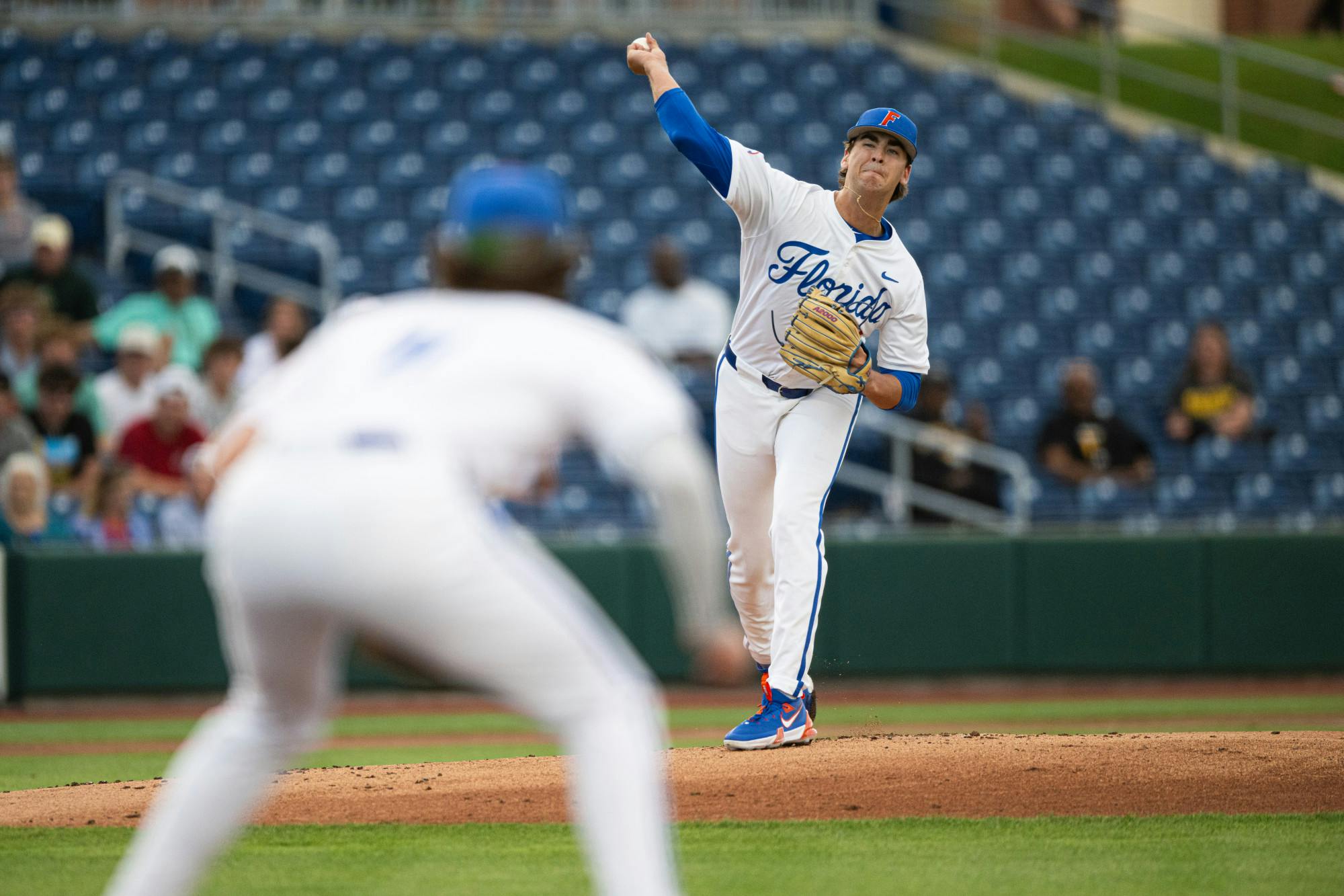 Florida Gators pitcher Liam Peterson (12) throws to first base in a baseball game against the Missouri Tigers on Thursday, April 10, 2025, in Gainesville, Fla.
