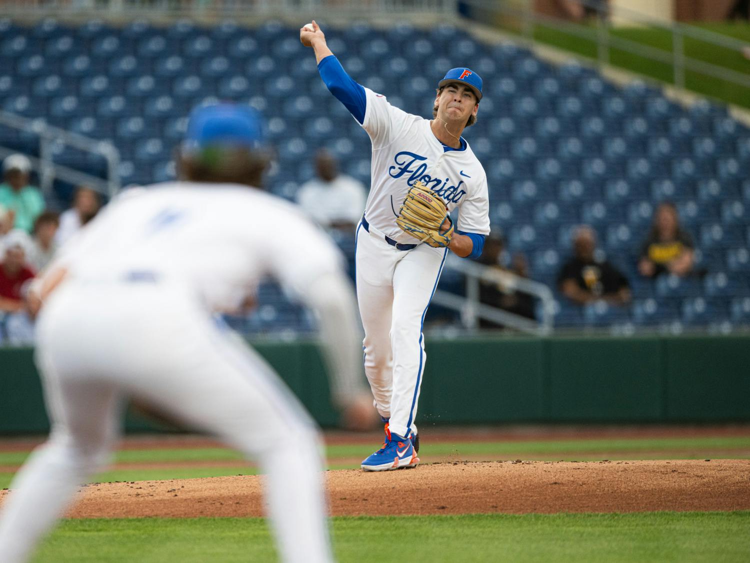 Florida Gators pitcher Liam Peterson (12) throws to first base in a baseball game against the Missouri Tigers on Thursday, April 10, 2025, in Gainesville, Fla.