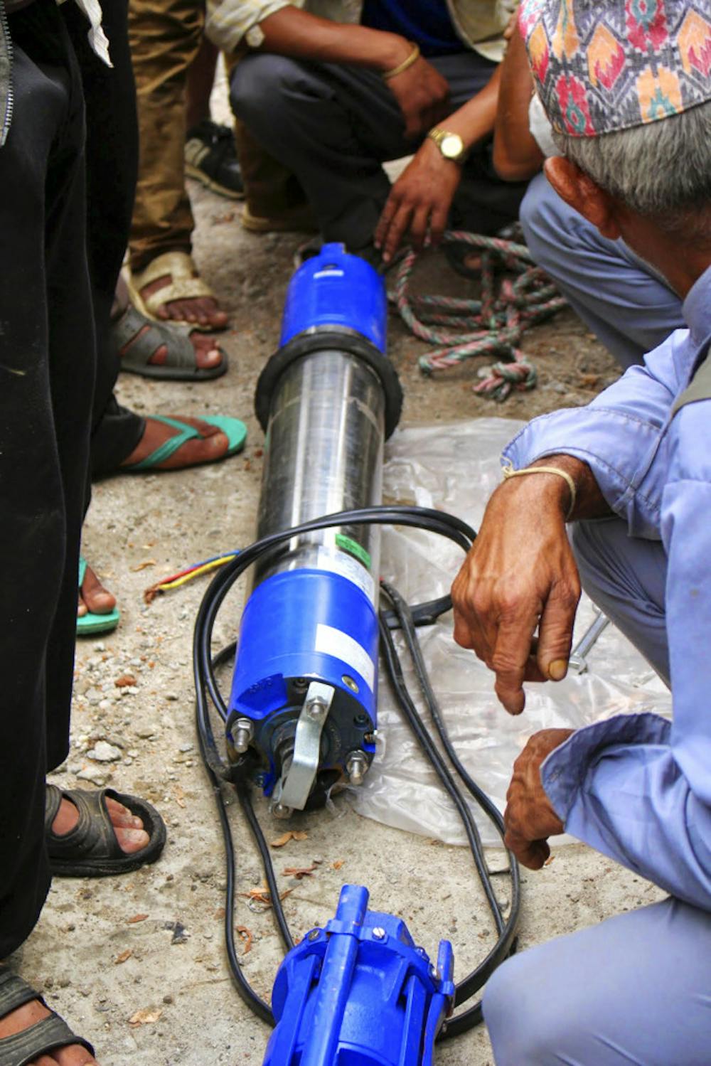 <p>UF’s Engineers without Borders install a new water pump in Nepal during their 2014 trip. This year, the a team of about seven students will return to Nepal to build a hand-washing stations and teach hygiene programs at the local schools.</p>