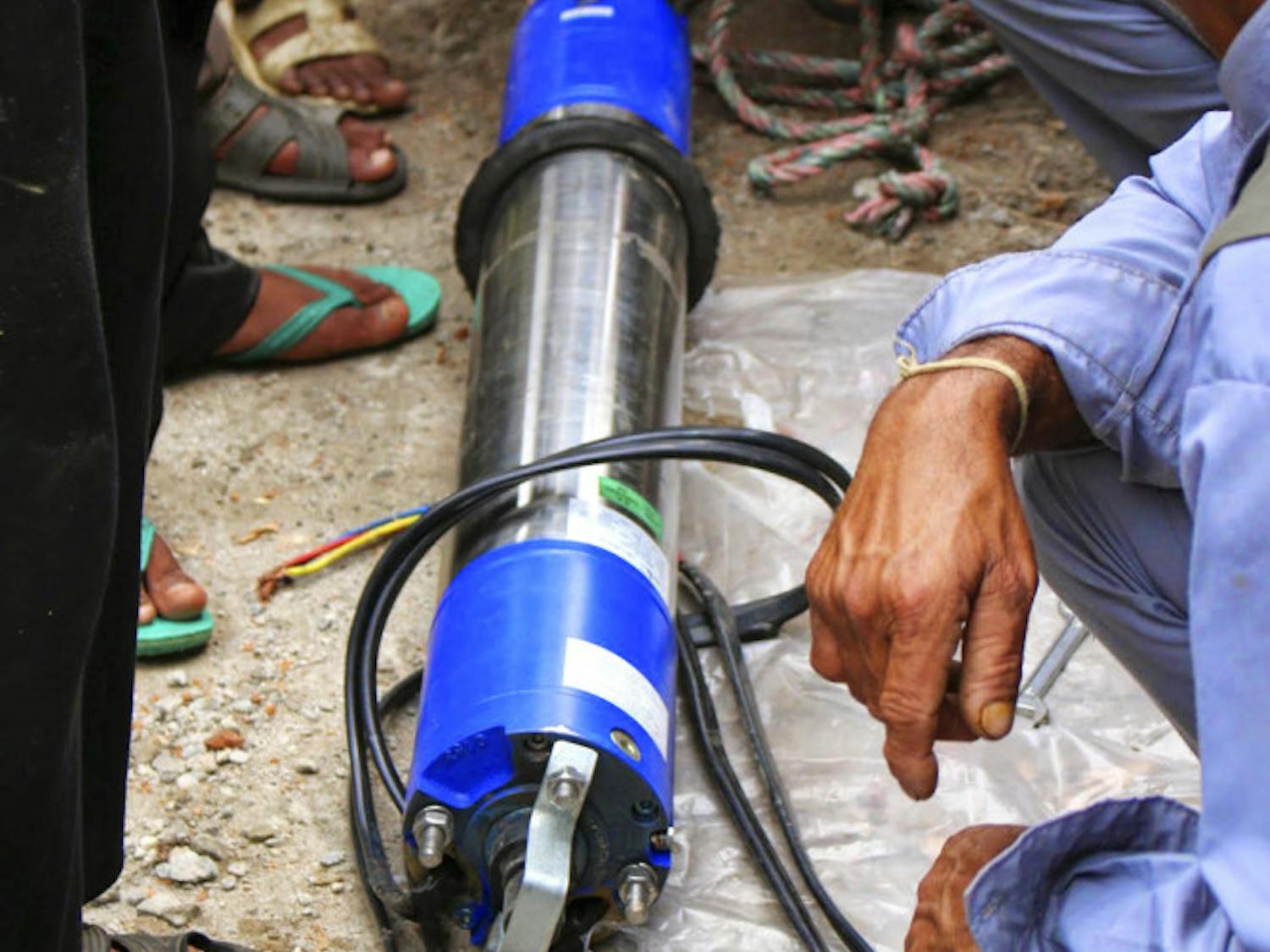 UF’s Engineers without Borders install a new water pump in Nepal during their 2014 trip. This year, the a team of about seven students will return to Nepal to build a hand-washing stations and teach hygiene programs at the local schools.