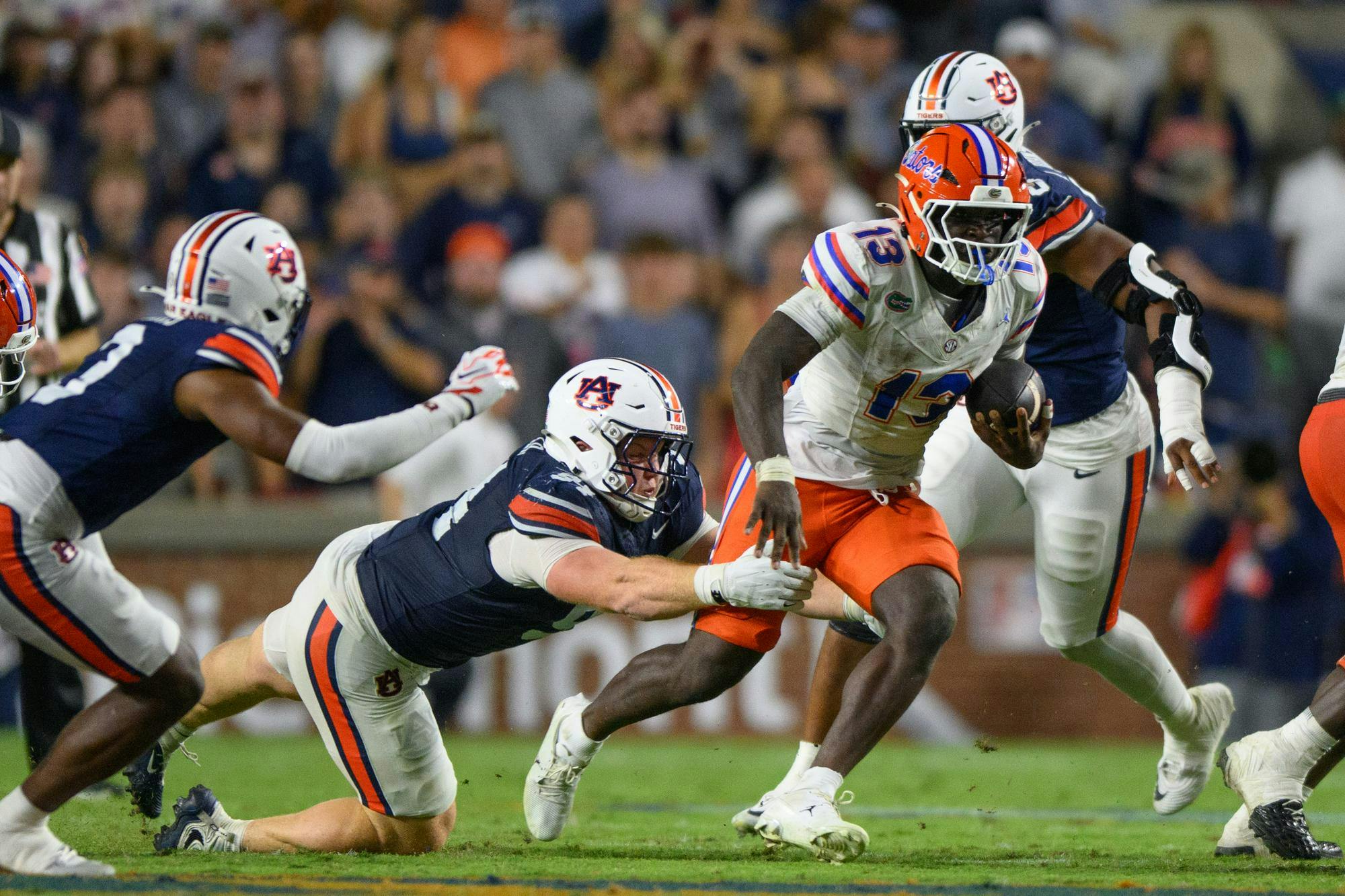 Florida running back Jadan Baugh (13) rushes during the first half of an NCAA college football game against Auburn, Saturday, Sept. 19, 2026, in Auburn, Ala.