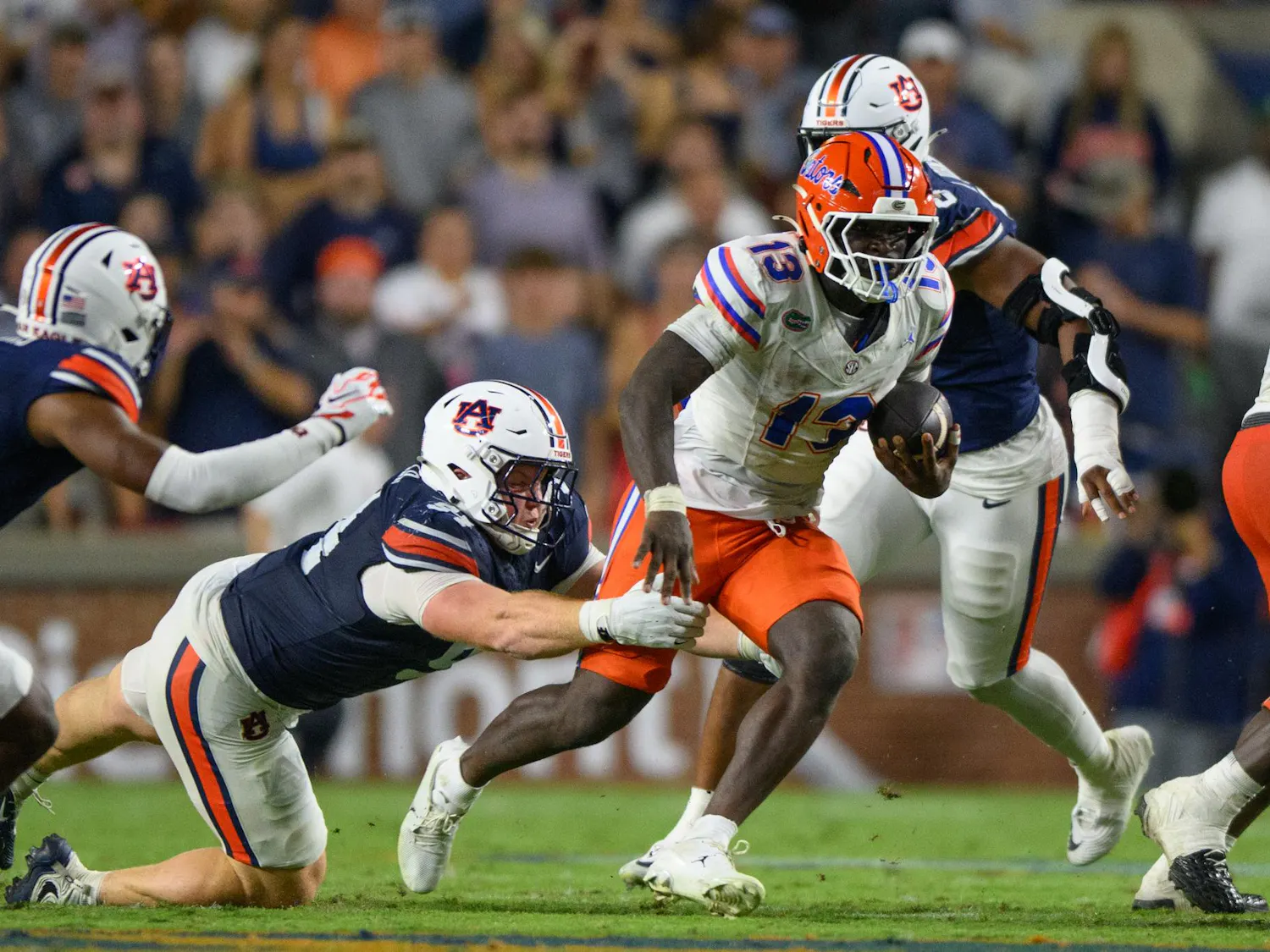 Florida running back Jadan Baugh (13) rushes during the first half of an NCAA college football game against Auburn, Saturday, Sept. 19, 2026, in Auburn, Ala.