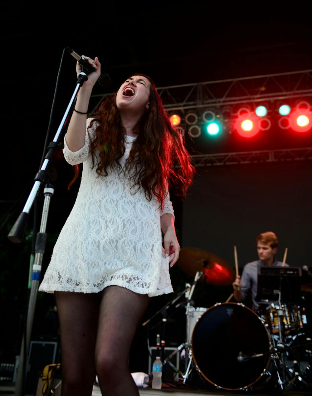 <p>Madeline Follin, of Cults, sings on Friday during Swampfest 2013. Cults opened, along with the band Ahmir for Matt and Kim, whose performance was canceled due to thunderstorms.</p>
