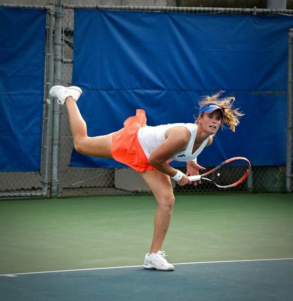<p>UF's Belinda Woolcock hits a serve during Florida's 4-2 win against Oklahoma State on Feb. 18, 2017, at the Ring Tennis Complex.</p>