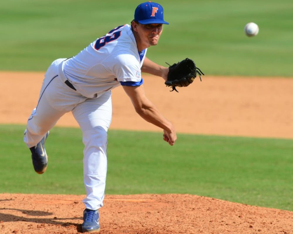 <p>Jonathon Crawford throws against Arkansas on April 29. Crawford lowered his ERA to 3.34 after giving up one unearned run in 5.2 innings against Auburn on Tuesday.</p>