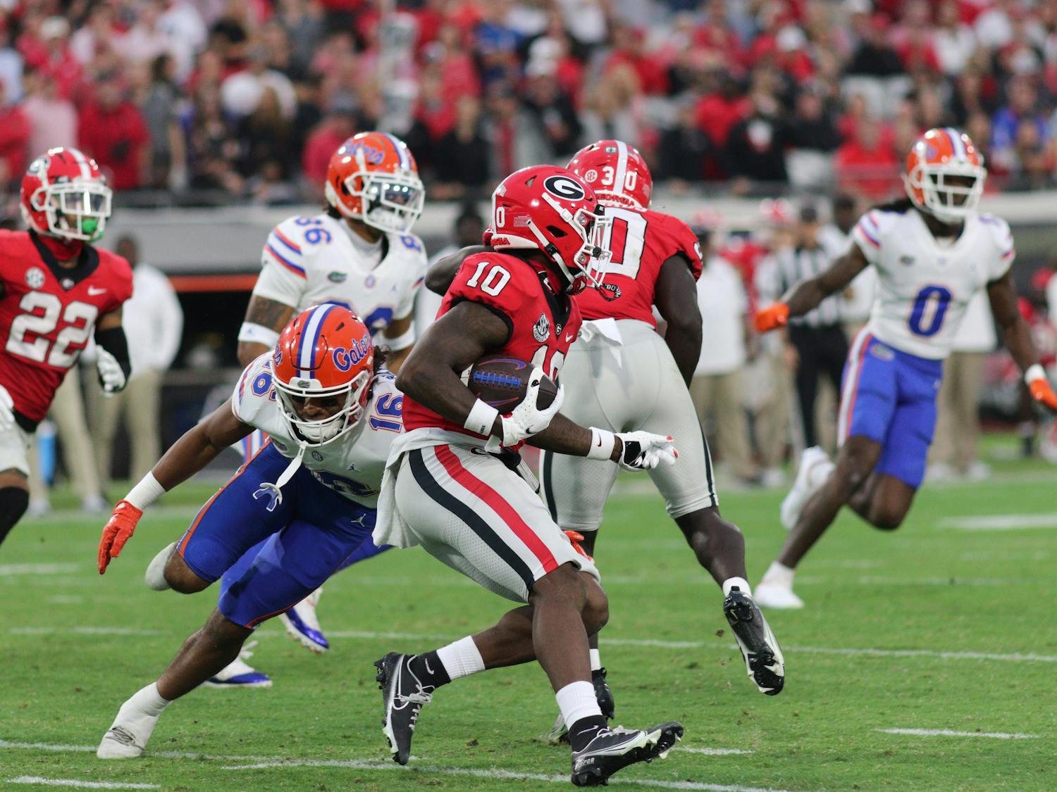 Gators safety Tre'Vez Johnson dives to make a tackle against a Georgia player in Florida's 42-20 loss to the Georgia Bulldogs on Saturday, Oct. 29, 2023.