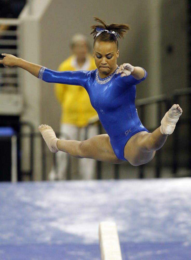 Florida's Kytra Hunter competes on the balance beam during the semifinals of the NCAA women's gymnastics championships Saturday, April 21 2012 in Duluth, Ga.