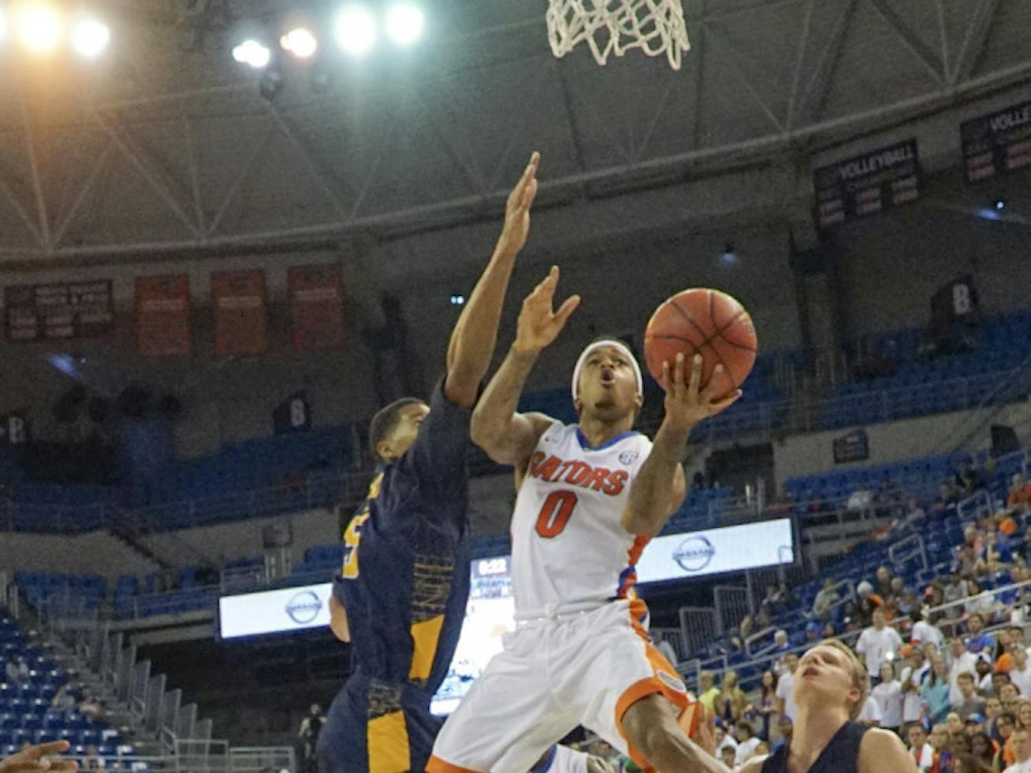 UF point guard Kasey Hill goes up for a layup during Florida's 104-54 win against North Carolina A&T on Nov. 16, 2015, in the O'Connell Center.
