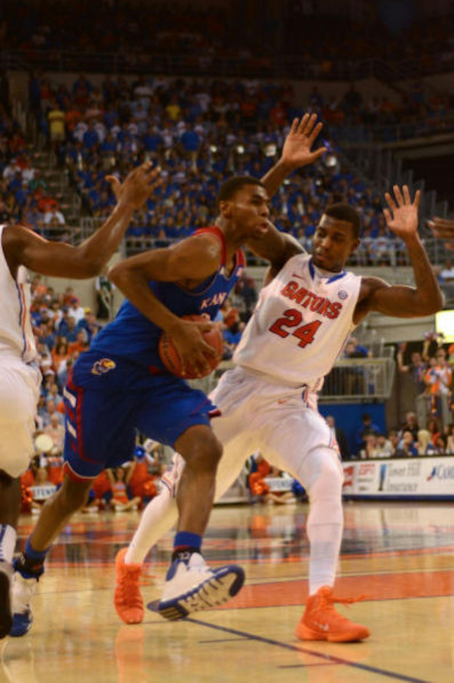 UK guard Andrew Wiggins drives past UF forward Casey Prather (24) during No. 19 Florida's 67-61 win against No. 13 Kansas on Tuesday night in the O'Connell Center.
