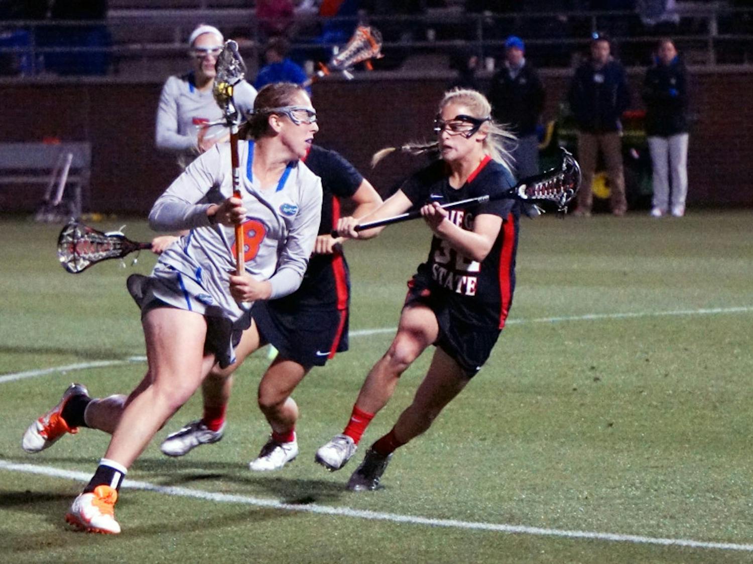 Shannon Gilroy runs toward the net during Florida's win against San Diego State at Donald R. Dizney Stadium.