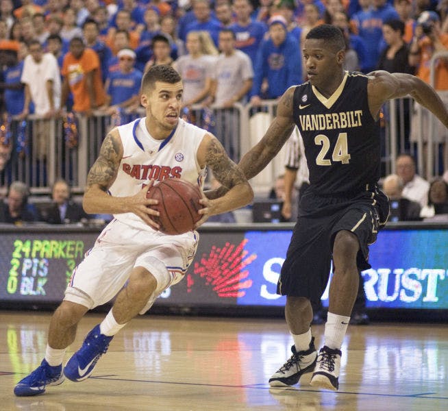 Junior point guard Scottie Wilbekin drives the lane during Florida’s 66-40 win against Vanderbilt on Wednesday in the O’Connell Center.
