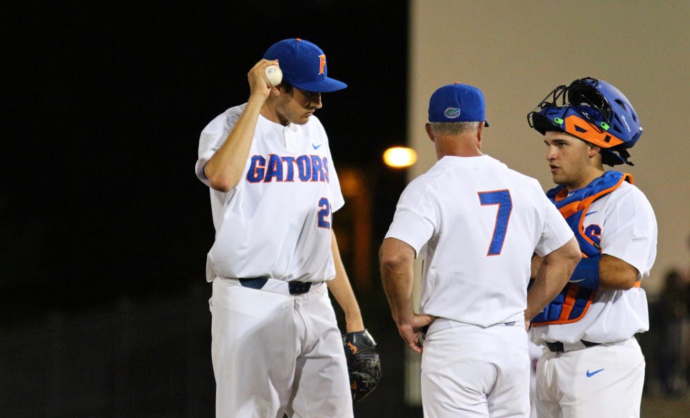 <p>Alex Faedo (left), Kevin O'Sullivan (center) and Mike Rivera convene at the mound during Florida's 1-0 win against LSU on March 24, 2017, at McKethan Stadium.</p>